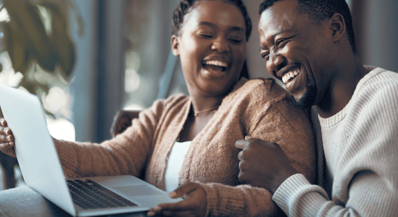 Couple sitting at laptop